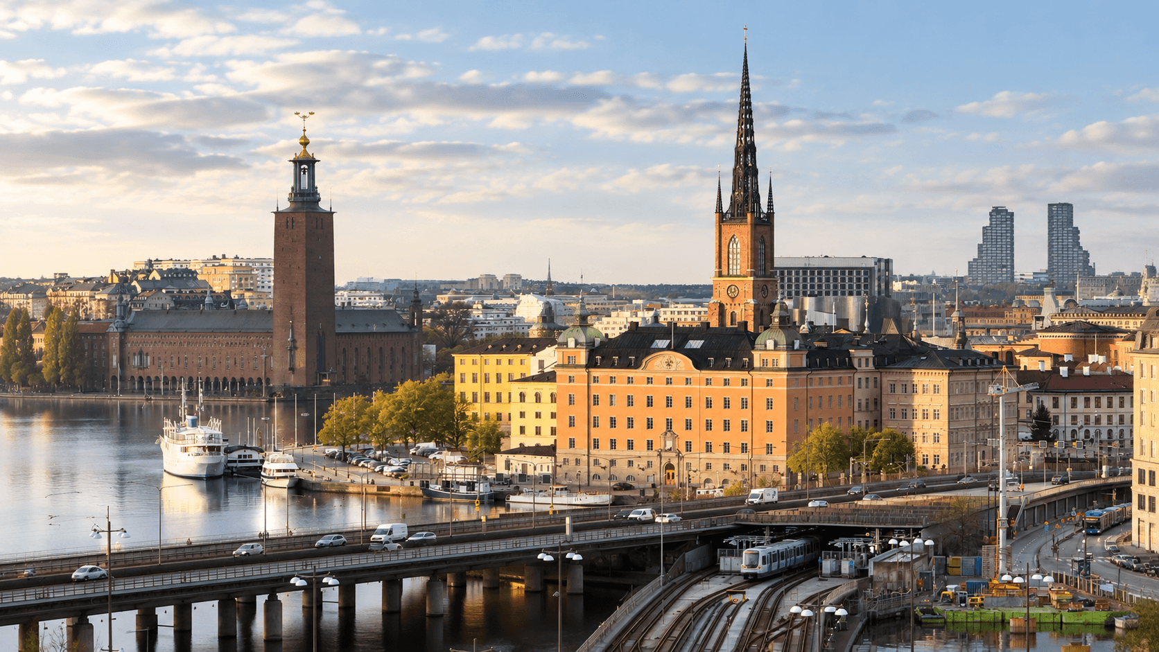 A panoramic view of Stockholm showing Riddarholmen and Stadshuset, with the City Hall and Riddarholmen Church prominently visible.